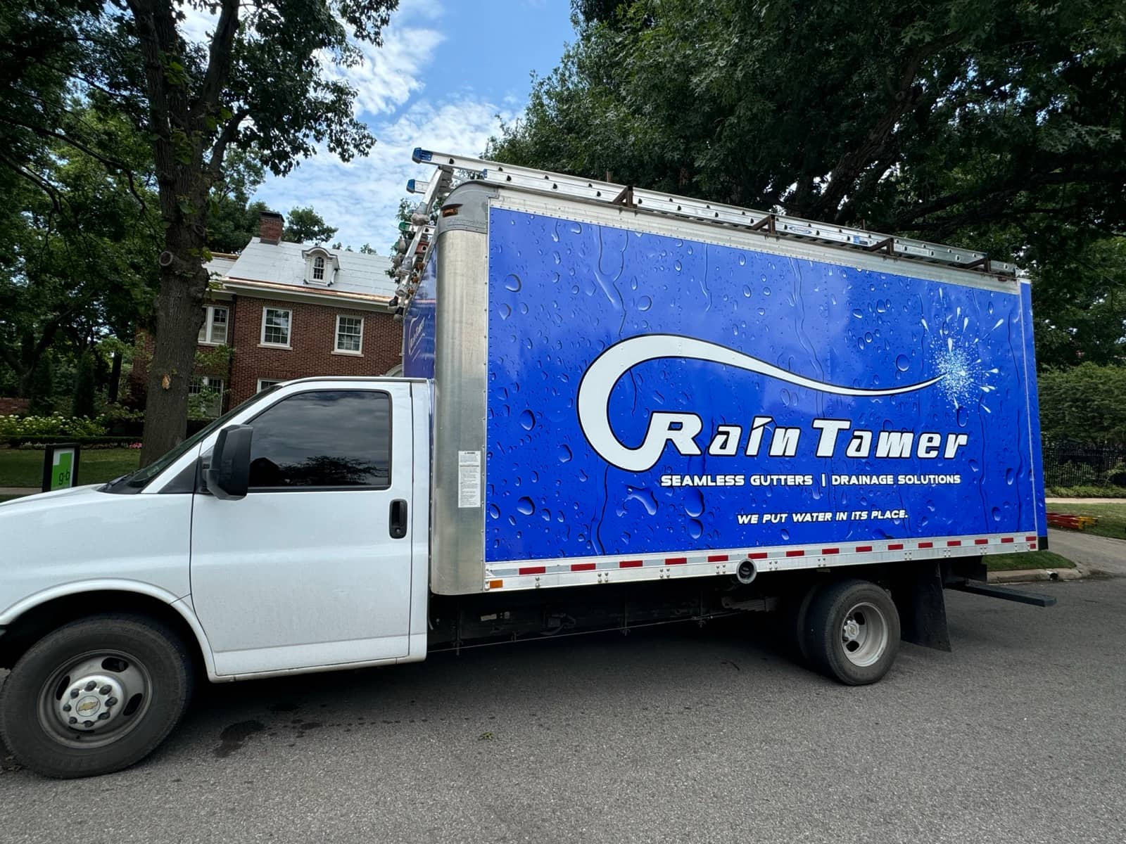 Side view of a Rain Tamer truck.
